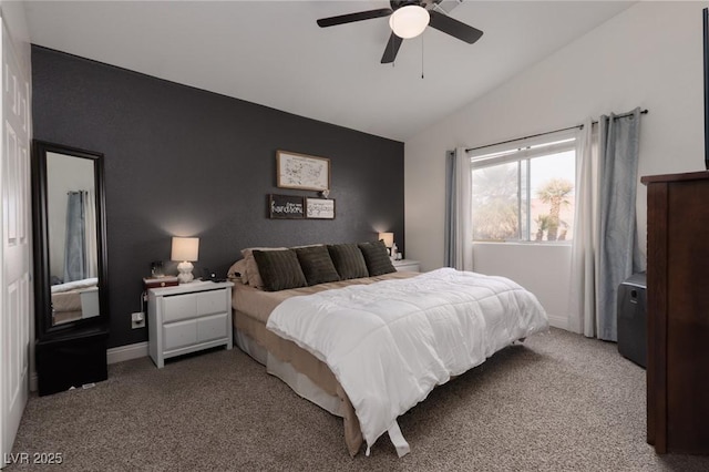 bedroom featuring vaulted ceiling, ceiling fan, and light carpet