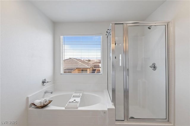 bathroom with shower with separate bathtub