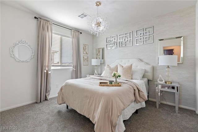 carpeted bedroom featuring a chandelier