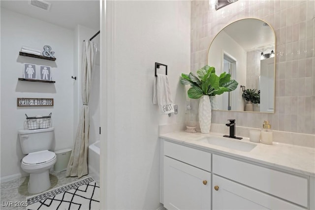 full bathroom featuring toilet, shower / bath combo with shower curtain, tasteful backsplash, tile walls, and vanity