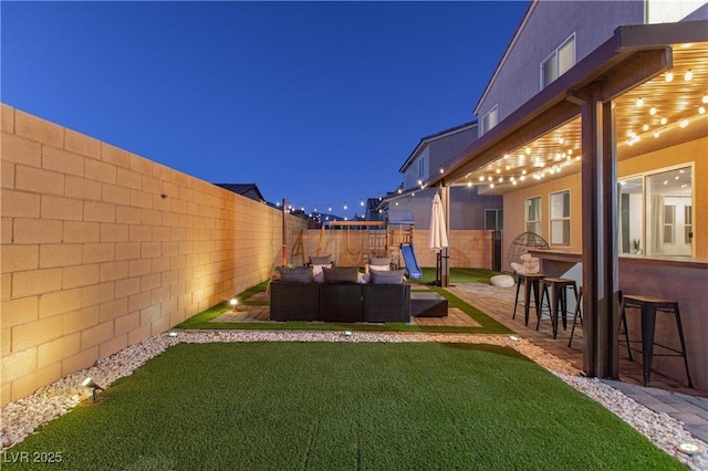 view of yard featuring a bar, a patio, and outdoor lounge area