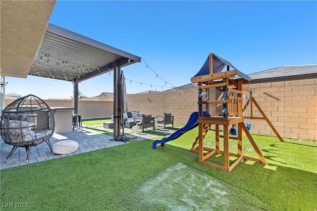 view of jungle gym with an outdoor living space with a fire pit, a patio, and a yard