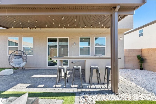 view of patio featuring a bar