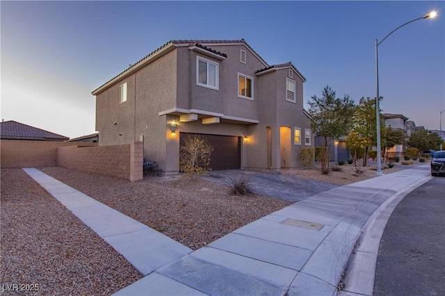 view of front of property featuring a garage