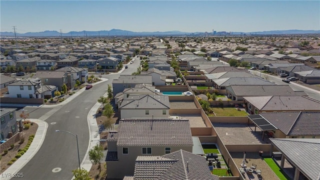 birds eye view of property featuring a mountain view