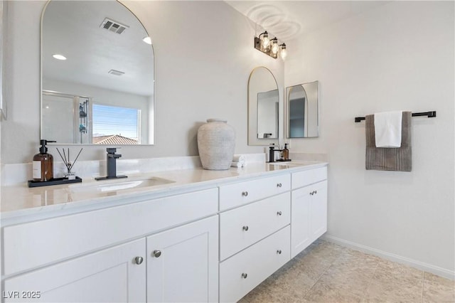 bathroom with walk in shower and vanity