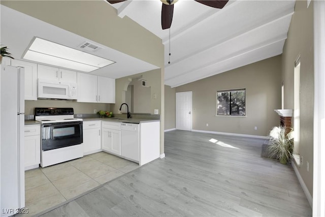 kitchen with white appliances, ceiling fan, white cabinets, lofted ceiling, and sink