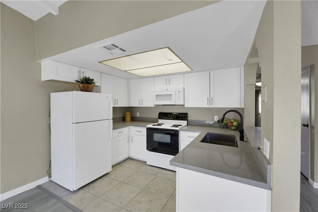 kitchen with sink, white appliances, light tile patterned flooring, and white cabinets