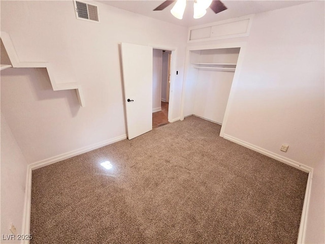 unfurnished bedroom featuring a closet, ceiling fan, and carpet flooring