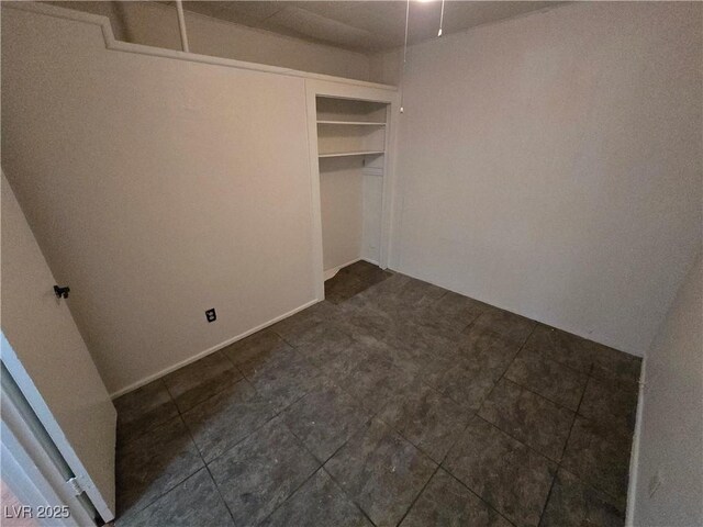 unfurnished bedroom with a closet