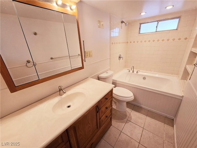 full bathroom featuring vanity, toilet, tiled shower / bath combo, and tile patterned flooring