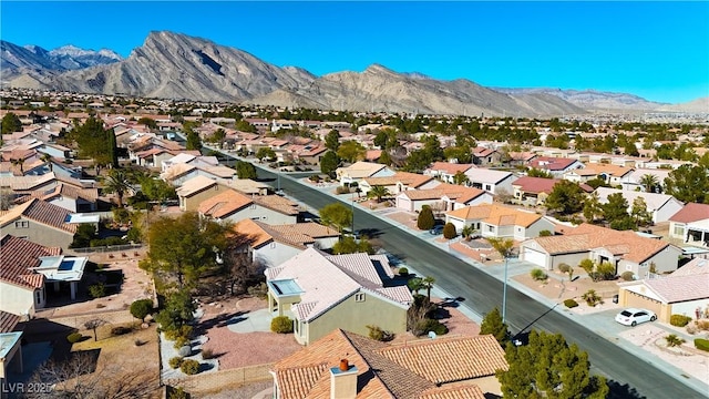 birds eye view of property featuring a mountain view