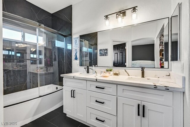 bathroom with shower / bath combination with glass door, tile patterned flooring, and vanity