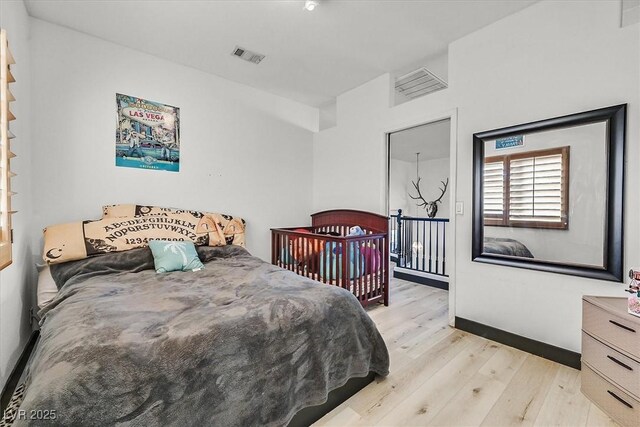 bedroom with light wood-type flooring