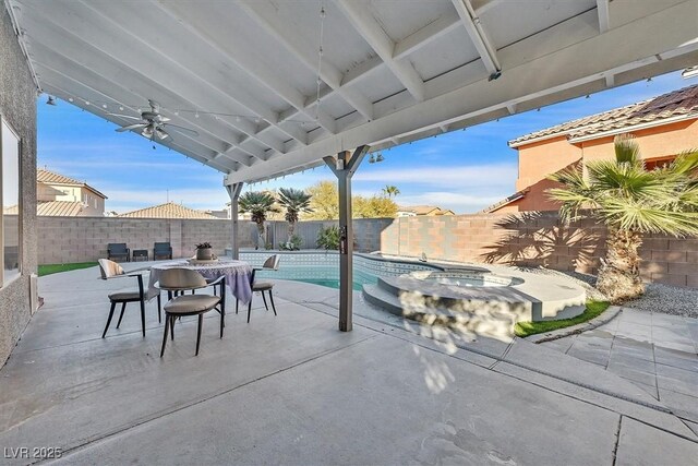 view of patio / terrace with a pool with hot tub and ceiling fan