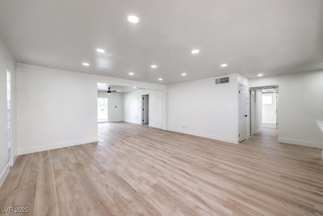 unfurnished living room with ceiling fan and light hardwood / wood-style flooring