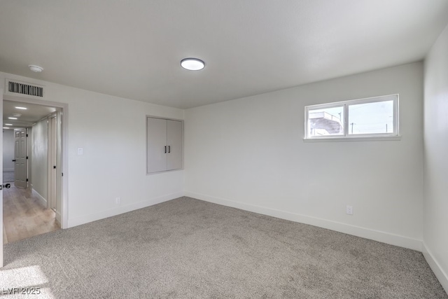 empty room featuring carpet flooring