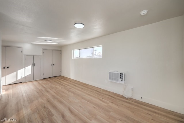 spare room with light hardwood / wood-style flooring