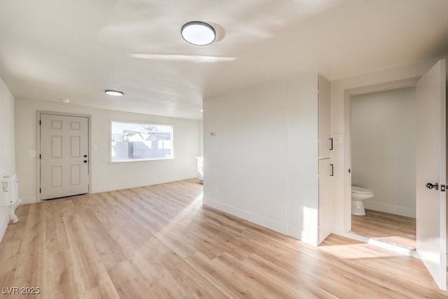 spare room featuring light wood-type flooring