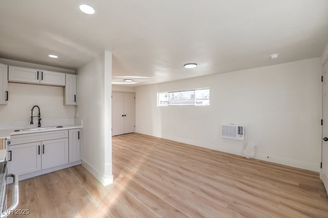 washroom with sink and light wood-type flooring