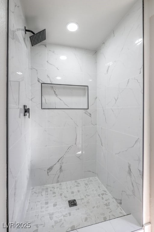 bathroom featuring tiled shower