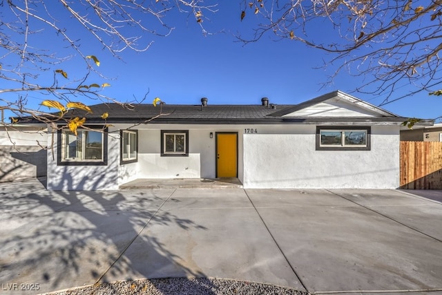 rear view of property featuring a patio area