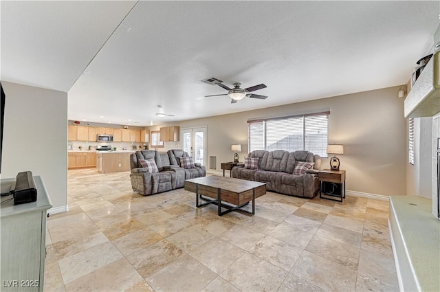 living room with ceiling fan