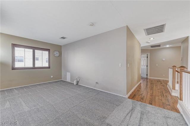 spare room featuring light hardwood / wood-style floors