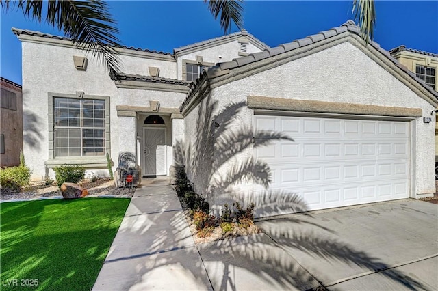 view of front of house with a front yard and a garage