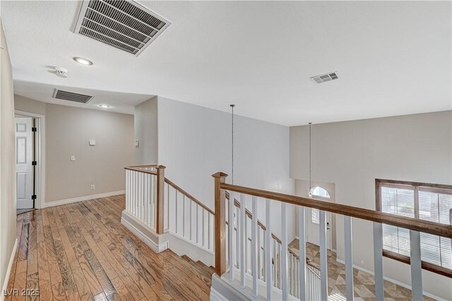 hallway with wood-type flooring