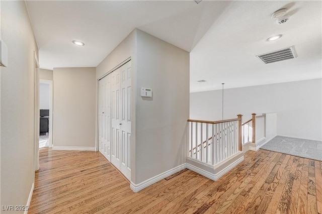 corridor featuring light hardwood / wood-style floors