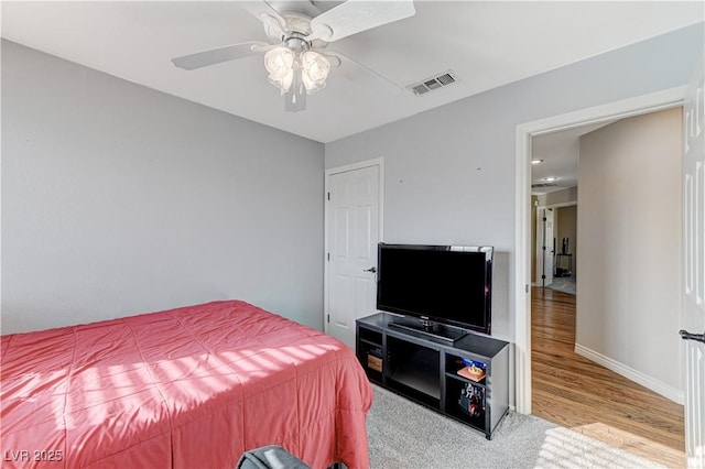 carpeted bedroom with ceiling fan