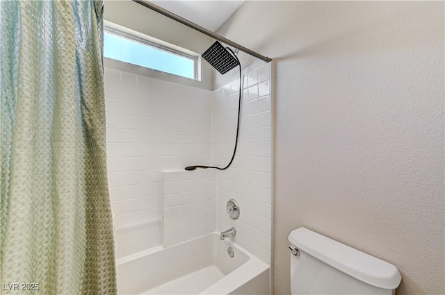 bathroom with toilet and shower / tub combo