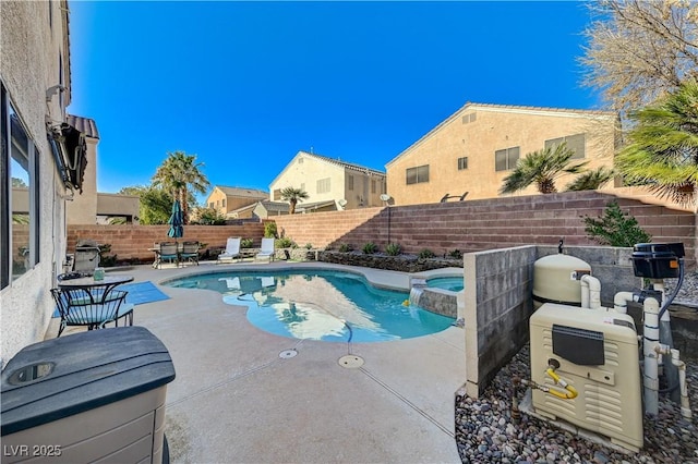 view of pool with a patio area and an in ground hot tub