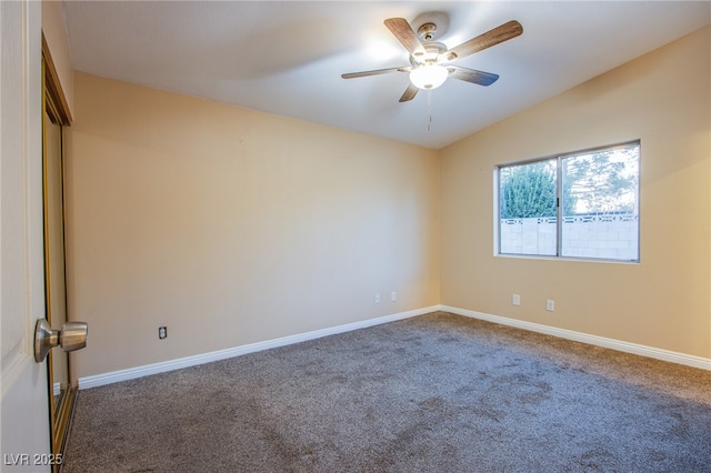 unfurnished room featuring ceiling fan, vaulted ceiling, and carpet flooring