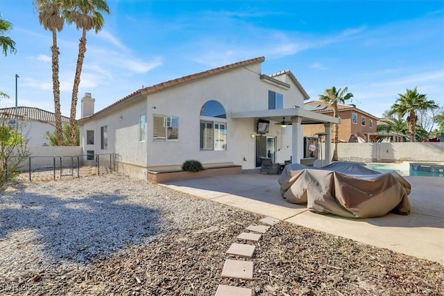 back of property with a patio area