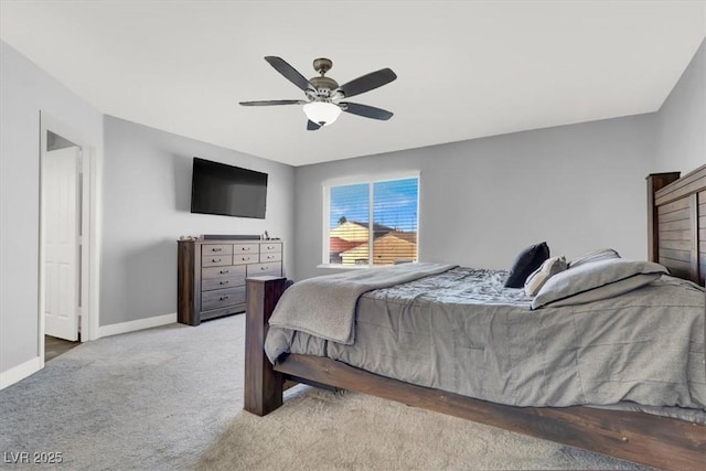 bedroom featuring ceiling fan and light carpet