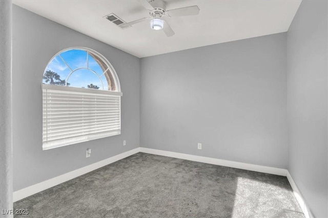 spare room with carpet floors and ceiling fan