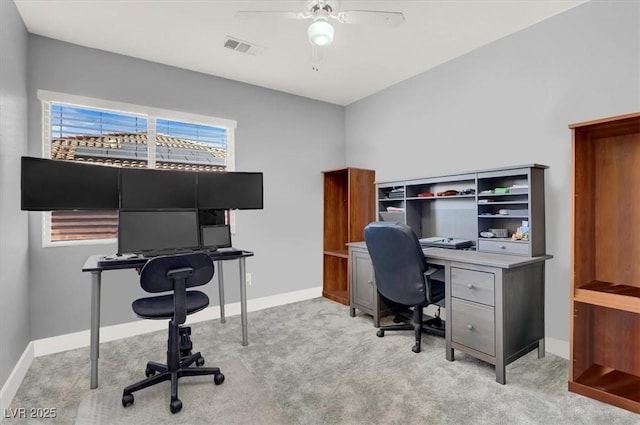 carpeted office with ceiling fan