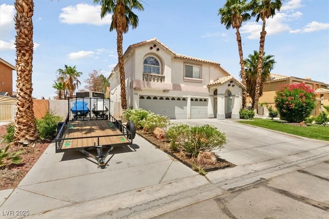 mediterranean / spanish-style home with a garage