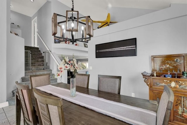 dining room featuring a notable chandelier and light tile patterned flooring