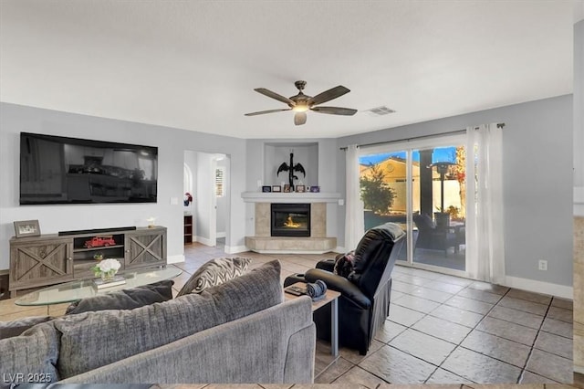 living room featuring light tile patterned flooring and ceiling fan