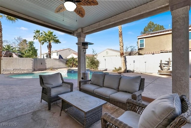 view of patio featuring ceiling fan, an outdoor hangout area, and a fenced in pool