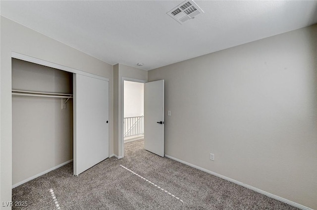 unfurnished bedroom featuring a closet and carpet