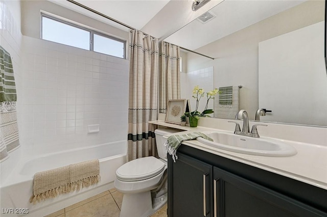 full bathroom featuring toilet, vanity, tile patterned floors, and shower / bath combo with shower curtain