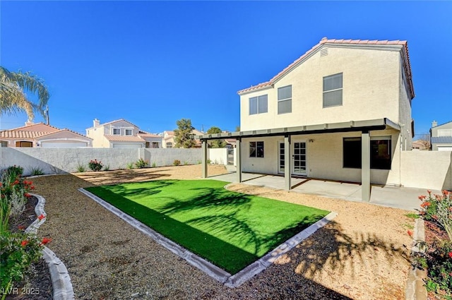 rear view of property with a patio area