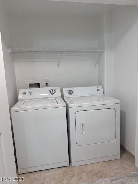 washroom with washing machine and dryer