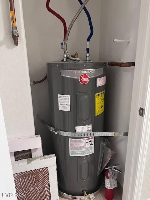 utility room featuring water heater