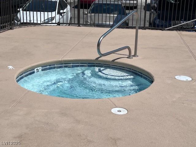 view of pool featuring a hot tub