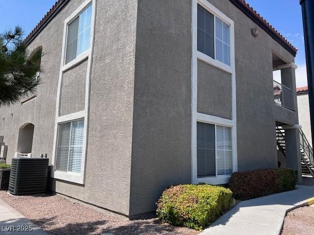 view of side of property with central AC unit